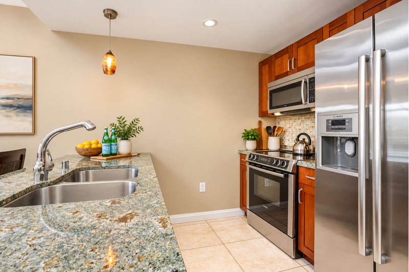Gather around granite elegance in this open, inviting kitchen space HKH-424