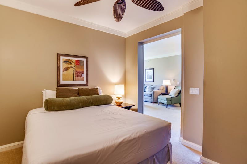 Ample natural light filters through sheer curtains for a gentle wake-up