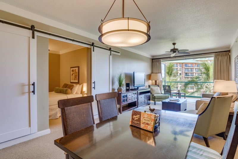Handcrafted wood accents and rich textures elevate this tropical dining retreat