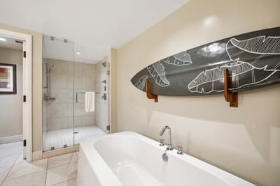 Soak away the day in a spa style tub with a touch of island charm