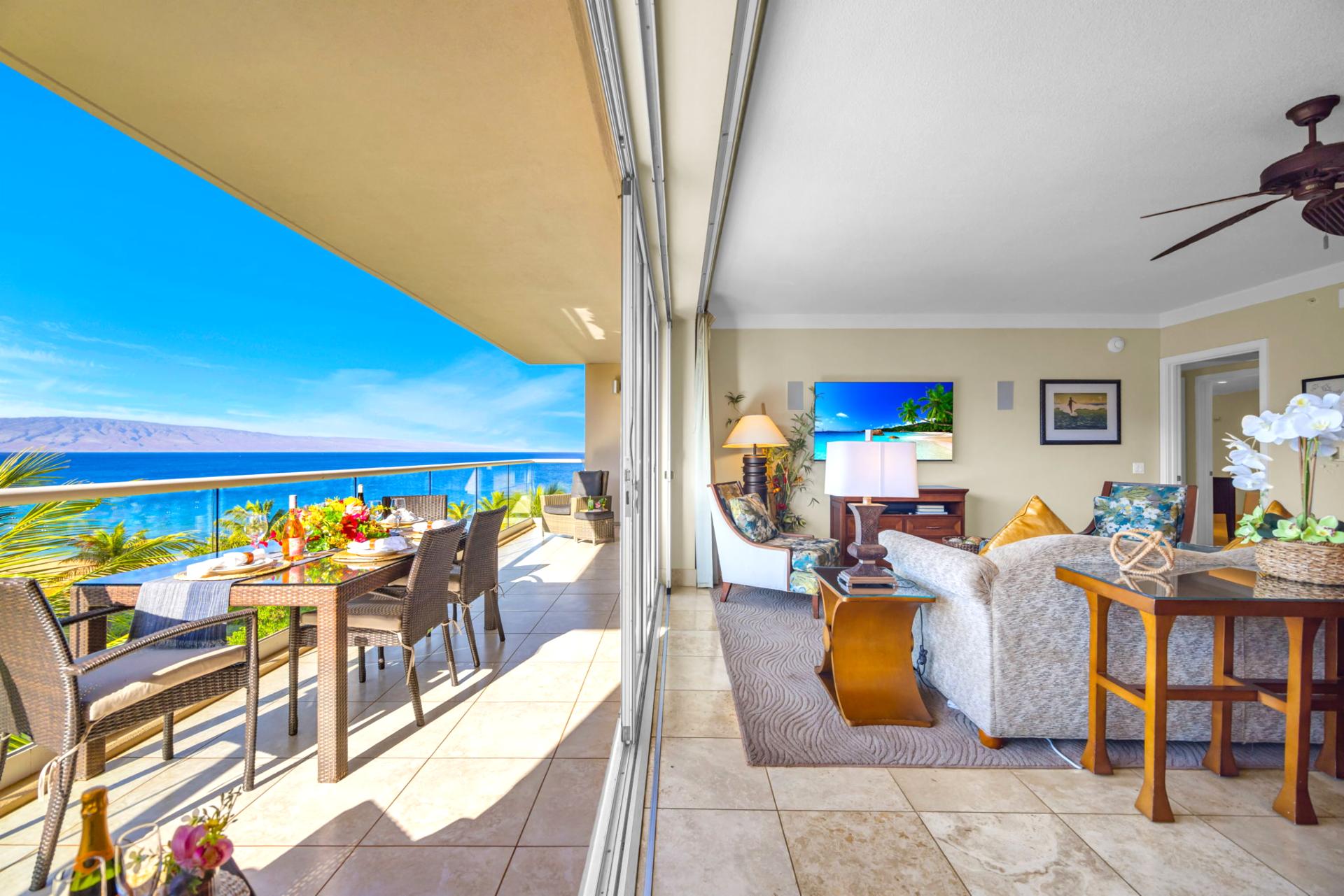 Shaded lanai space with partial ocean view and comfortable seating for morning coffee or sunset unwinding.