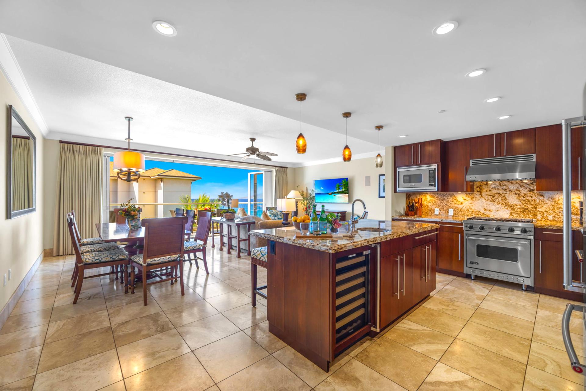 Granite countertops, custom cabinetry, and full-size appliances provide everything needed for at-home meals.