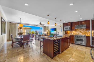 Granite countertops, custom cabinetry, and full-size appliances provide everything needed for at-home meals. HKH-504