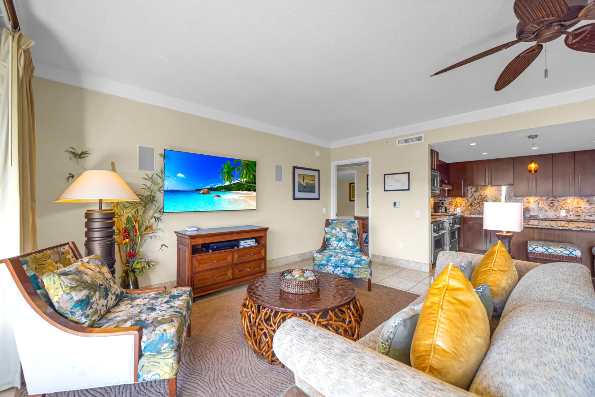 Living room with large windows and warm tones offers both comfort and connection to the outdoors.