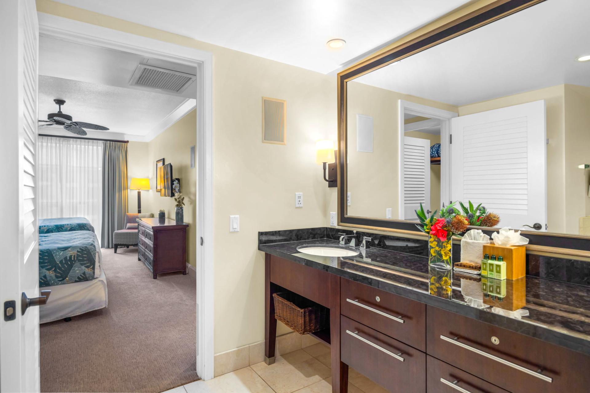 En suite guest bath with granite counters and spacious layout.