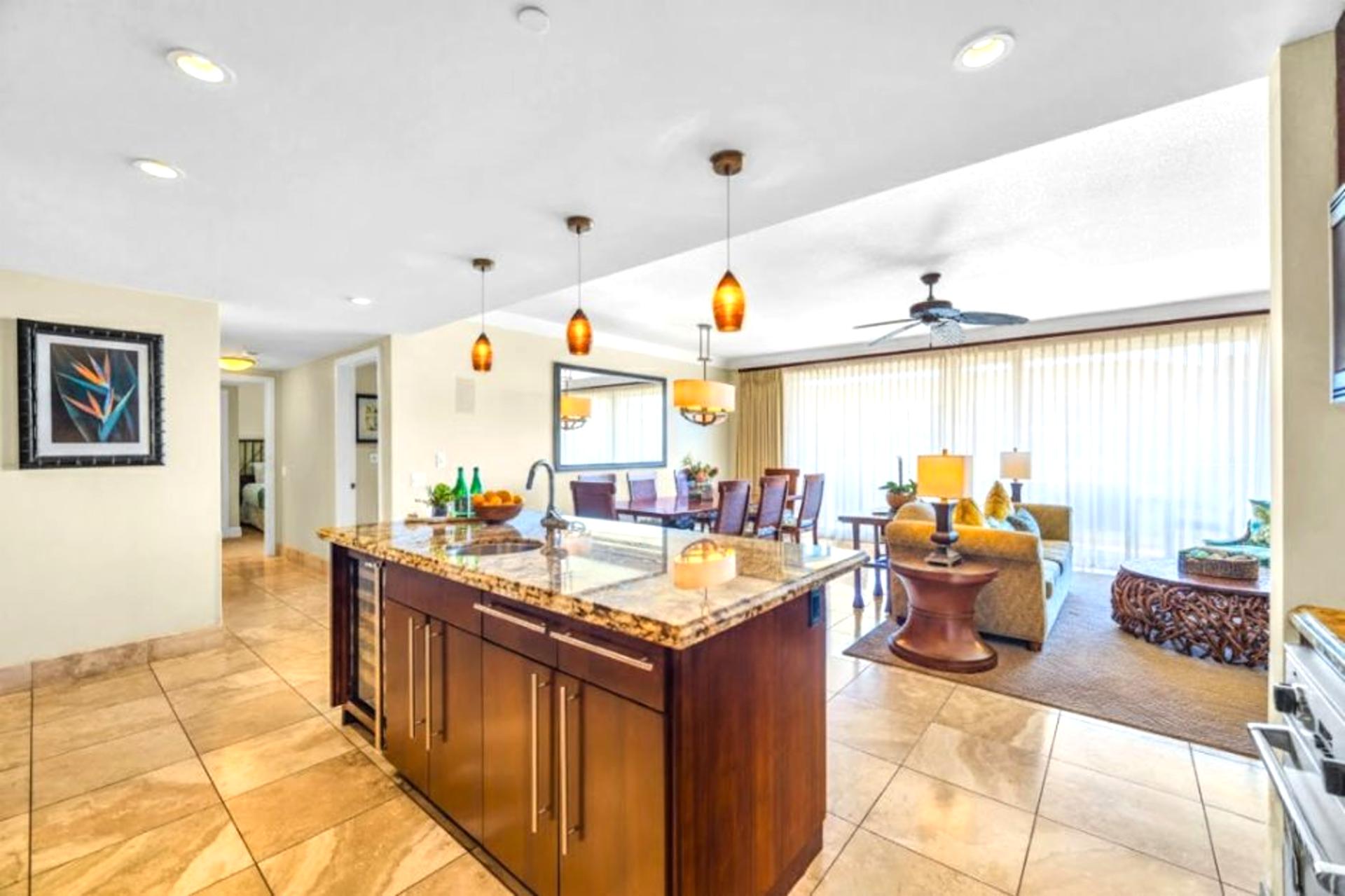 Extended view of kitchen and hallway shows the property’s open layout and easy flow.