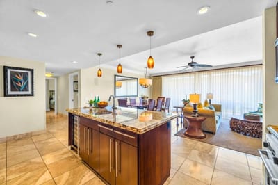 Extended view of kitchen and hallway shows the property’s open layout and easy flow. HKH-504