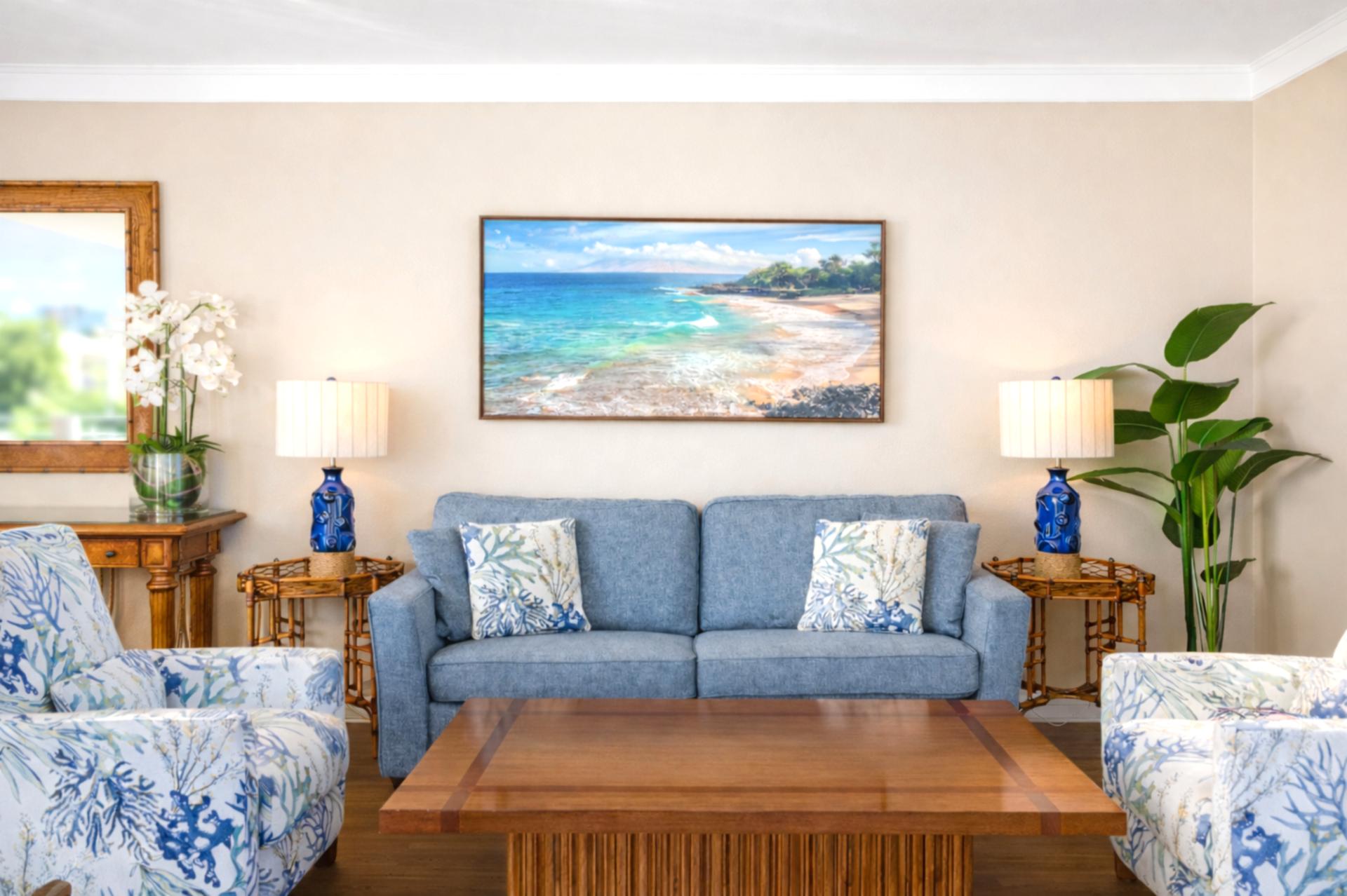 Soft coastal tones and comfortable seating welcome you into the living room, where large doors open toward the lanai and invite Maui’s natural light inside.