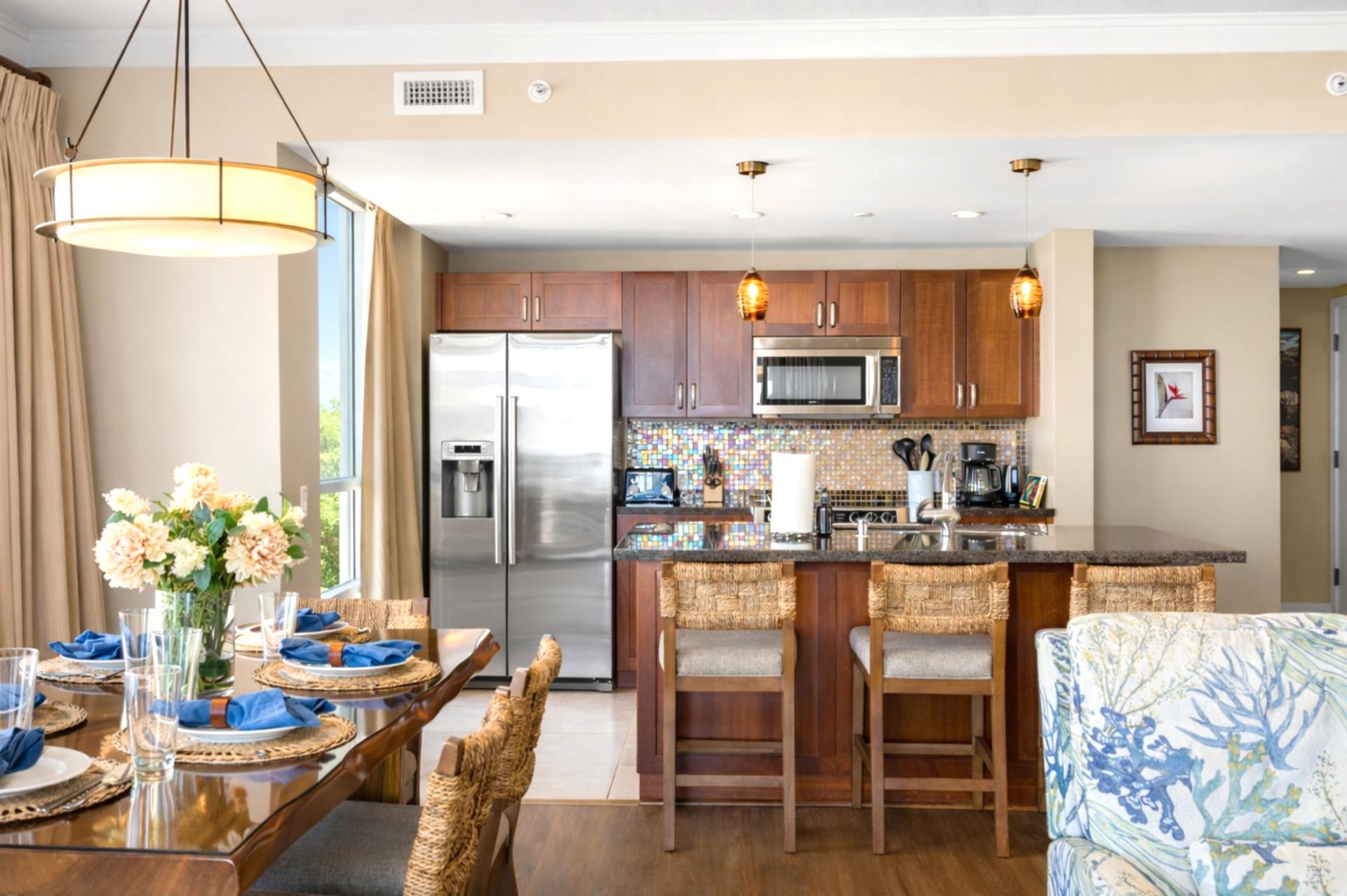Your open dining area sits beside the kitchen and living room, creating an inviting place to gather for meals, conversation, and shared vacation moments.
