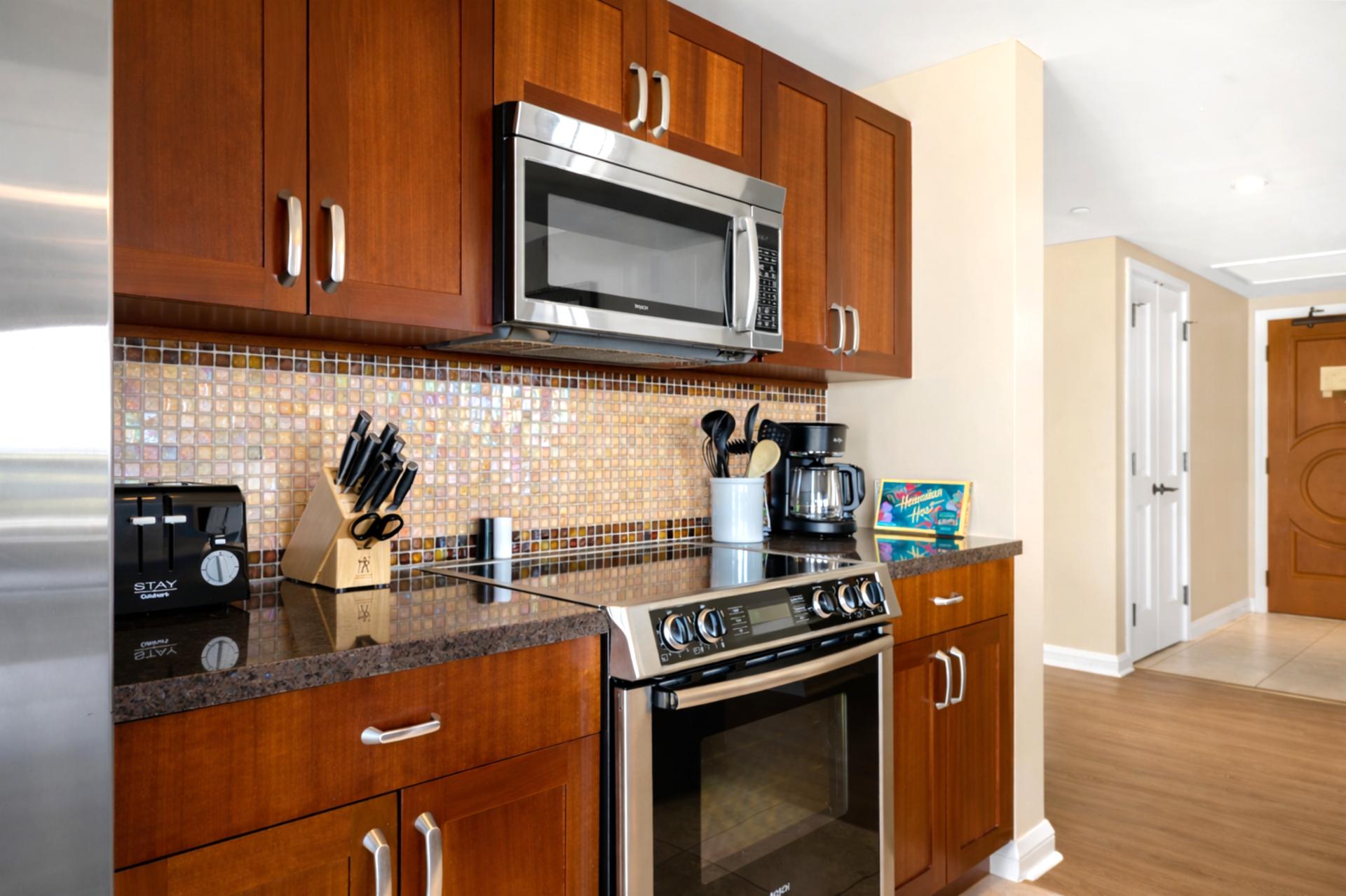 Bosch stainless steel appliances and rich cabinetry bring style and function to your kitchen, ready for everything from morning coffee to full island dinners.