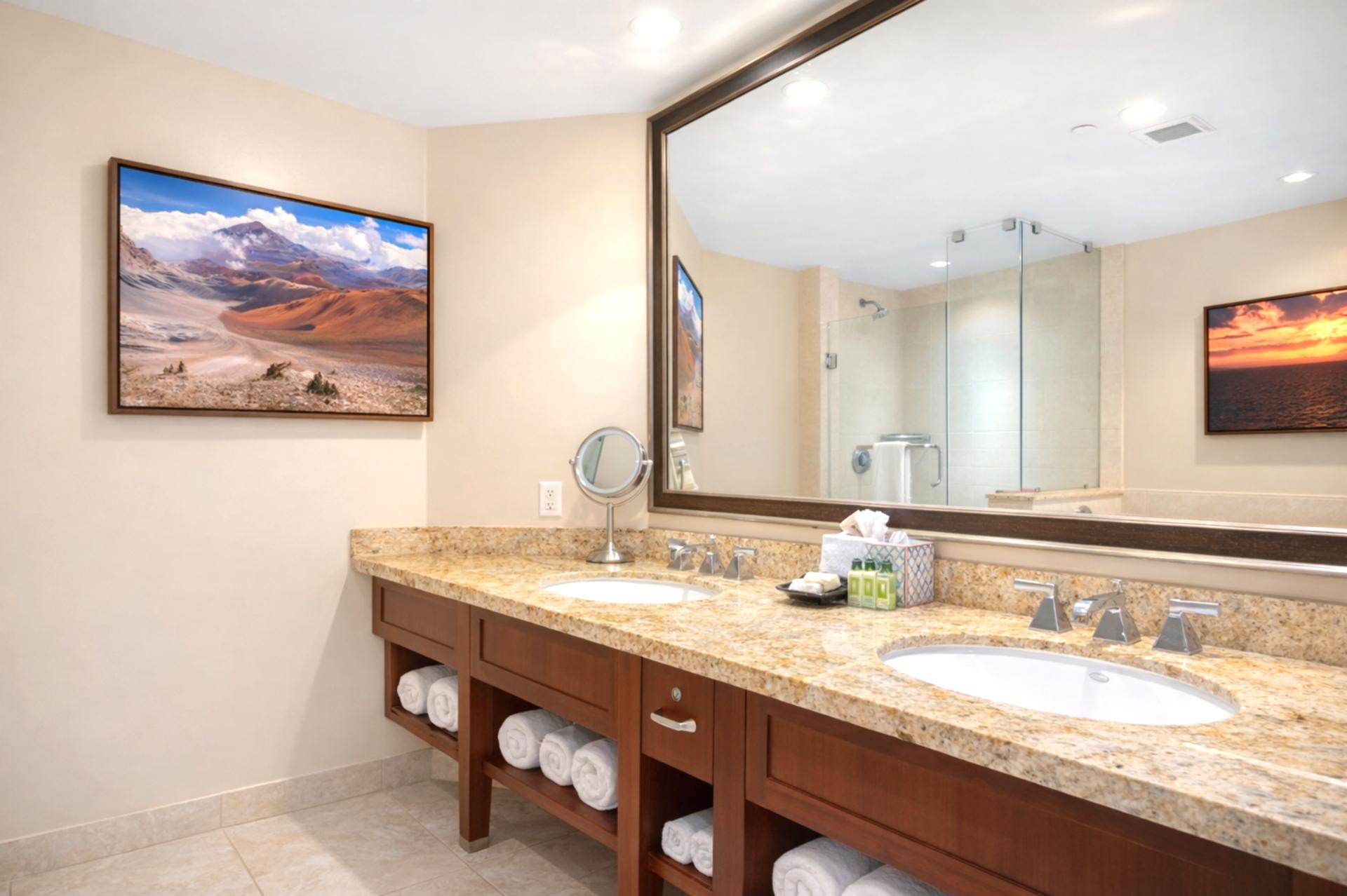 A granite double vanity offers generous counter space in your Primary Bathroom, making it easy to get ready for dinner or island adventures.