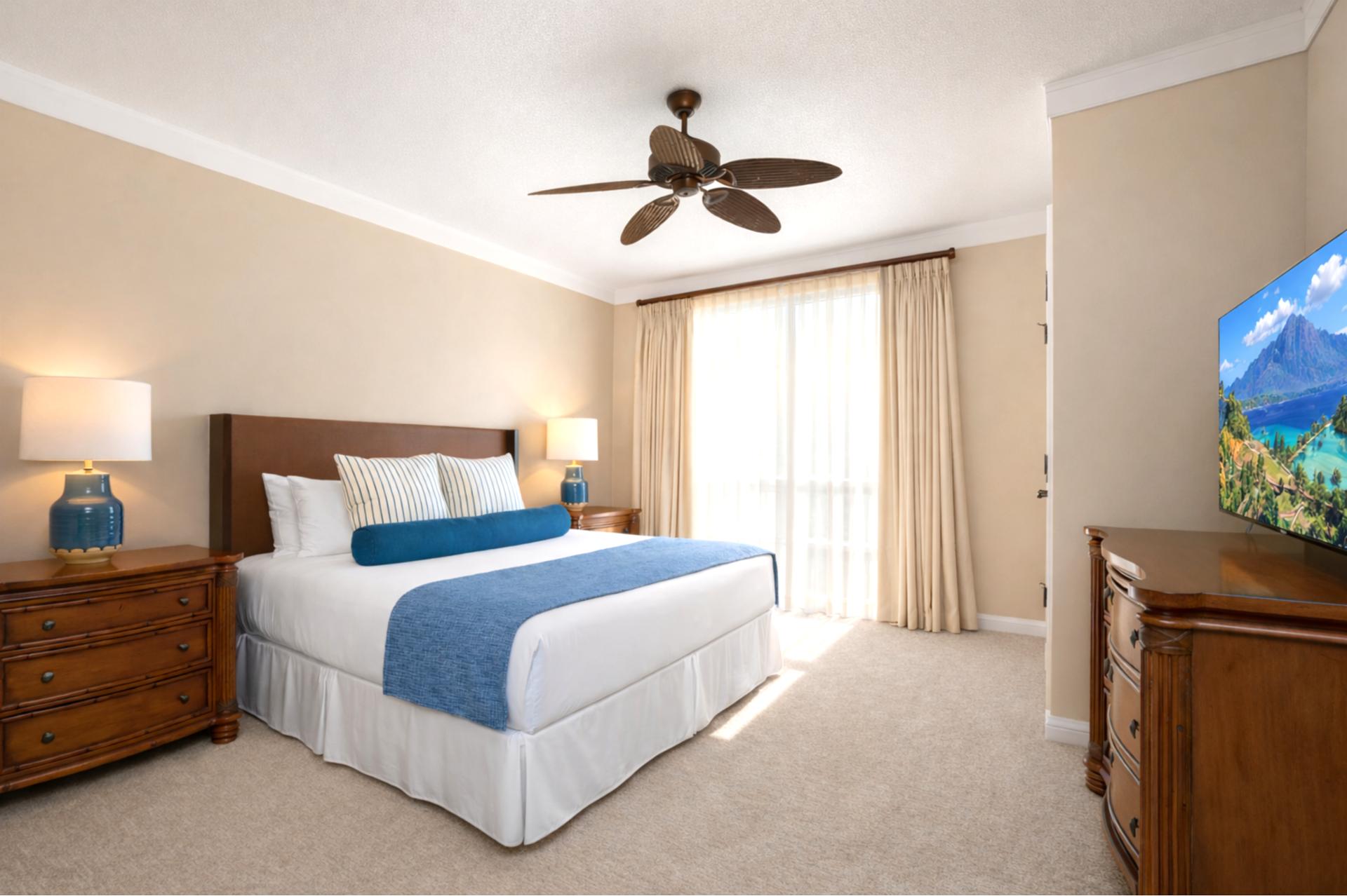 Soft lighting and calming décor create a peaceful atmosphere in the second bedroom, where plush bedding makes winding down after the beach effortless.