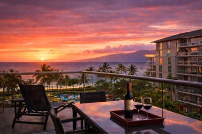 Evening settles over your lanai as sunset colors glow across the sky, creating a peaceful setting for cocktails or a quiet moment above the resort. HKH-515