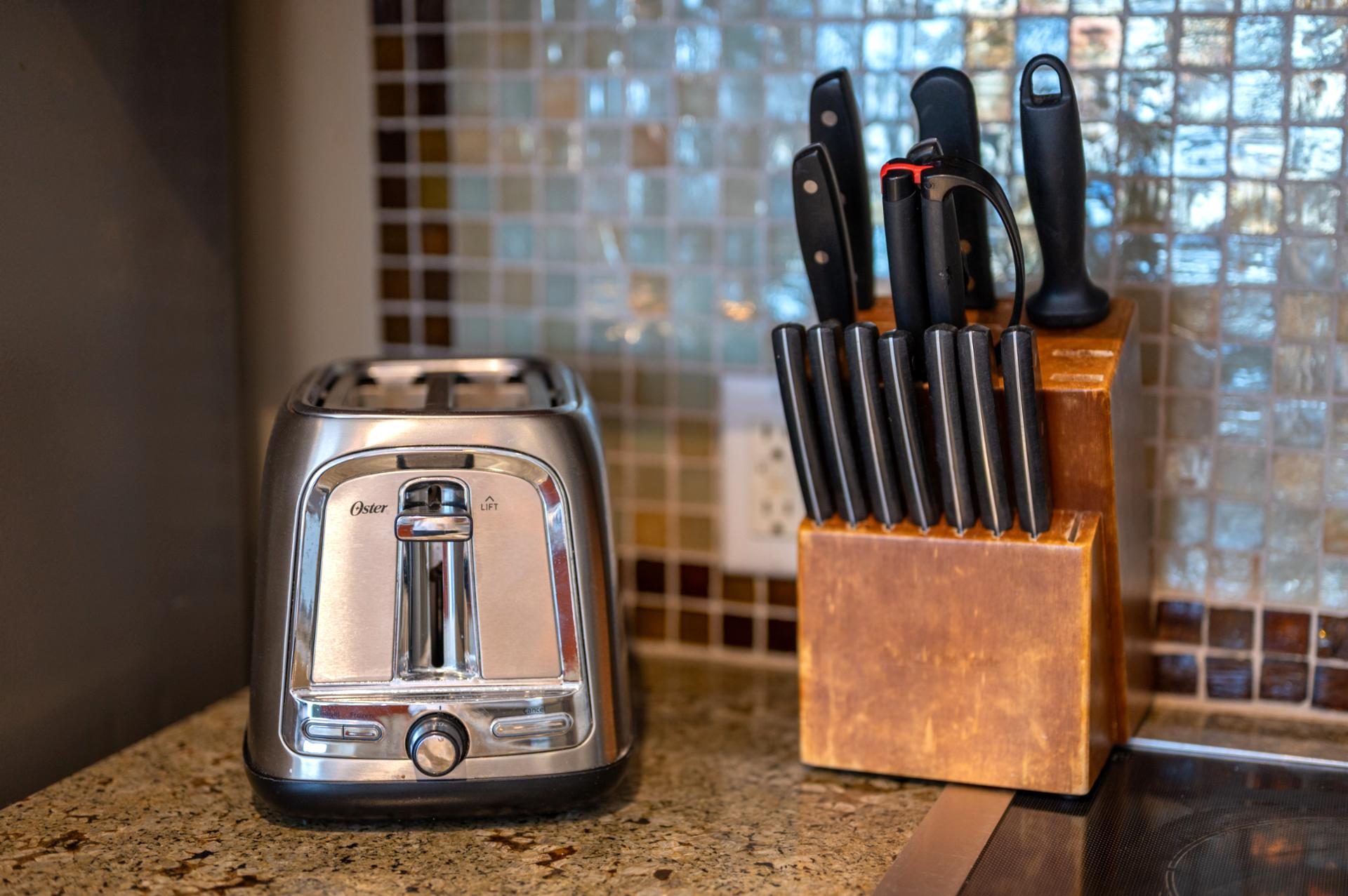 Your kitchen comes ready with essentials like a stainless toaster and full knife set, everything you need for easy vacation meals.