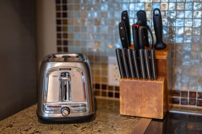 Your kitchen comes ready with essentials like a stainless toaster and full knife set, everything you need for easy vacation meals. HKH-520