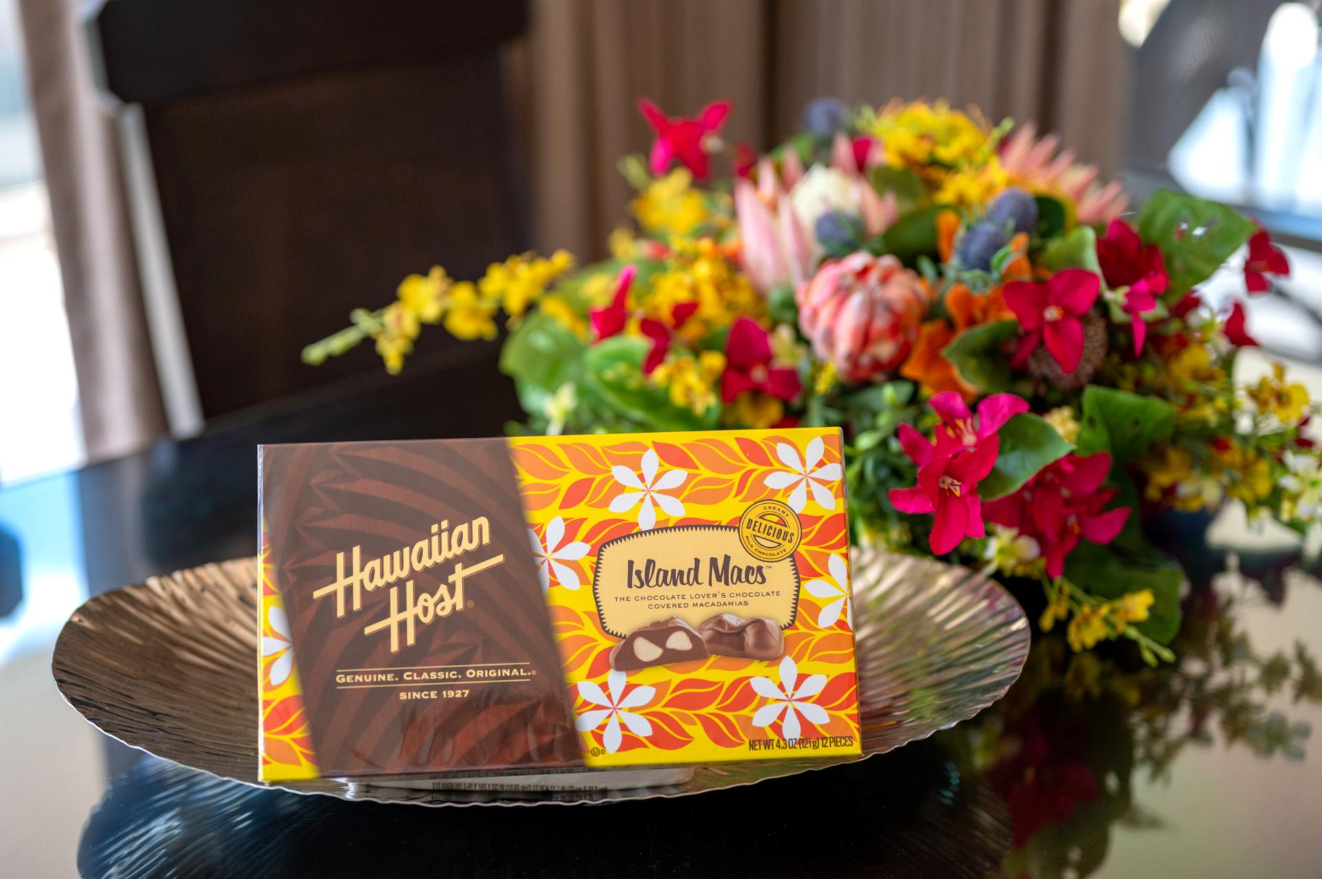 A sweet island welcome awaits with chocolate-covered macadamias and tropical flowers greeting you on arrival.