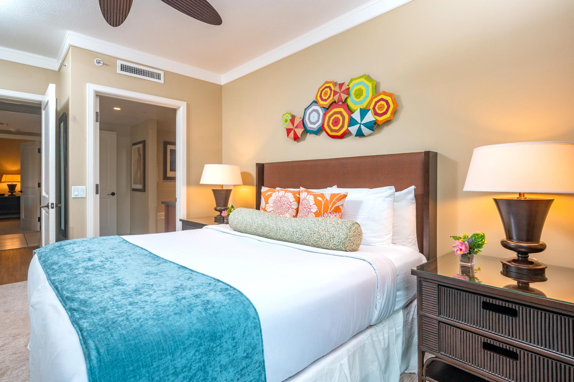 This cheerful guest room features a King bed, playful island decor, and a private entry to the adjacent full bathroom.