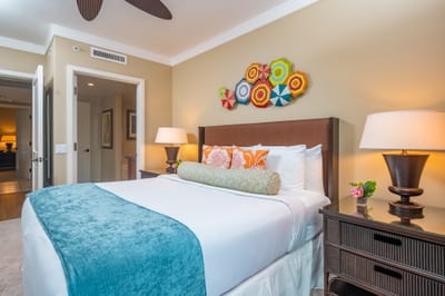 This cheerful guest room features a King bed, playful island decor, and a private entry to the adjacent full bathroom. HKH-520