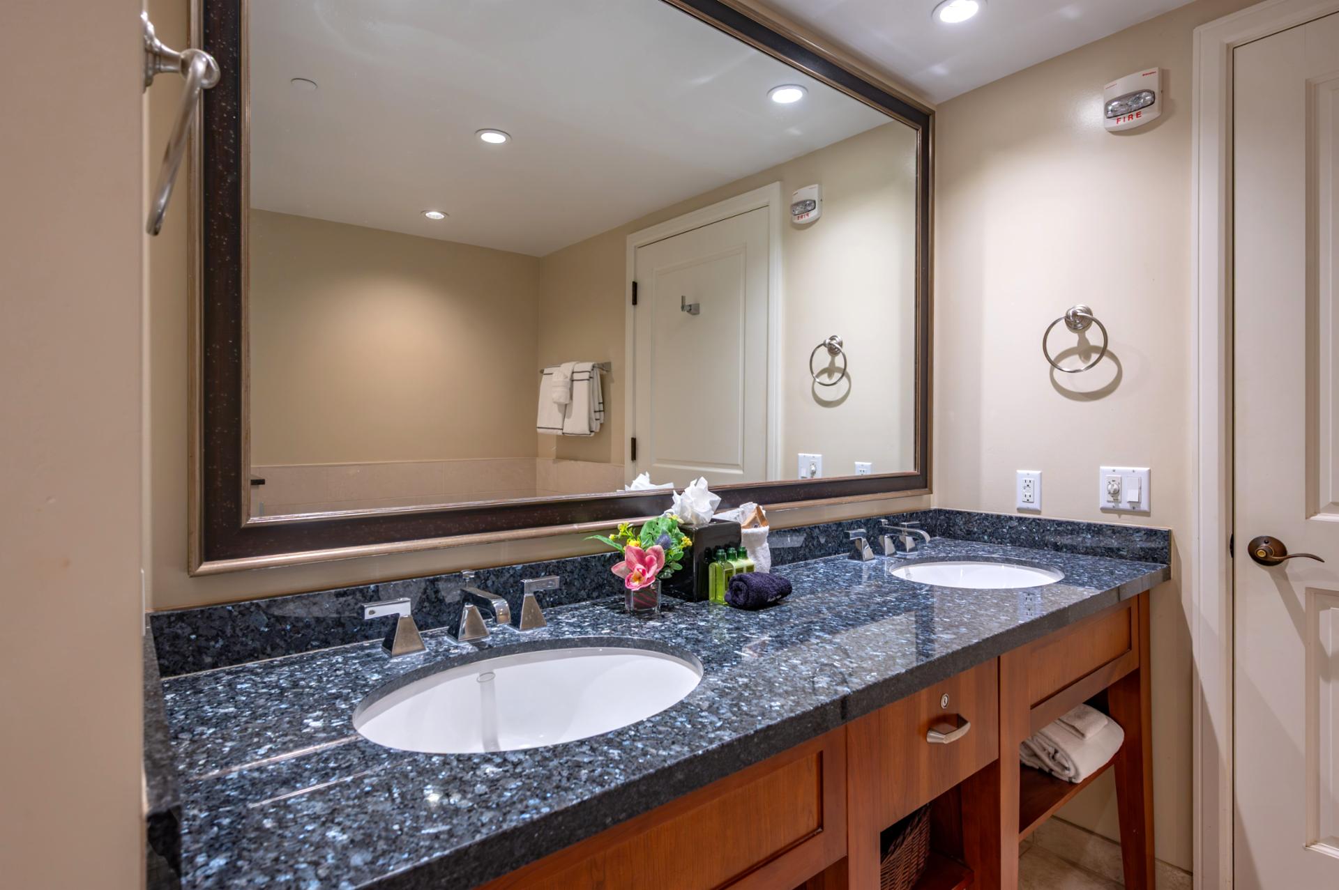 Your guest bathroom includes a granite dual vanity and spacious layout, offering comfort and convenience for couples or friends traveling together.