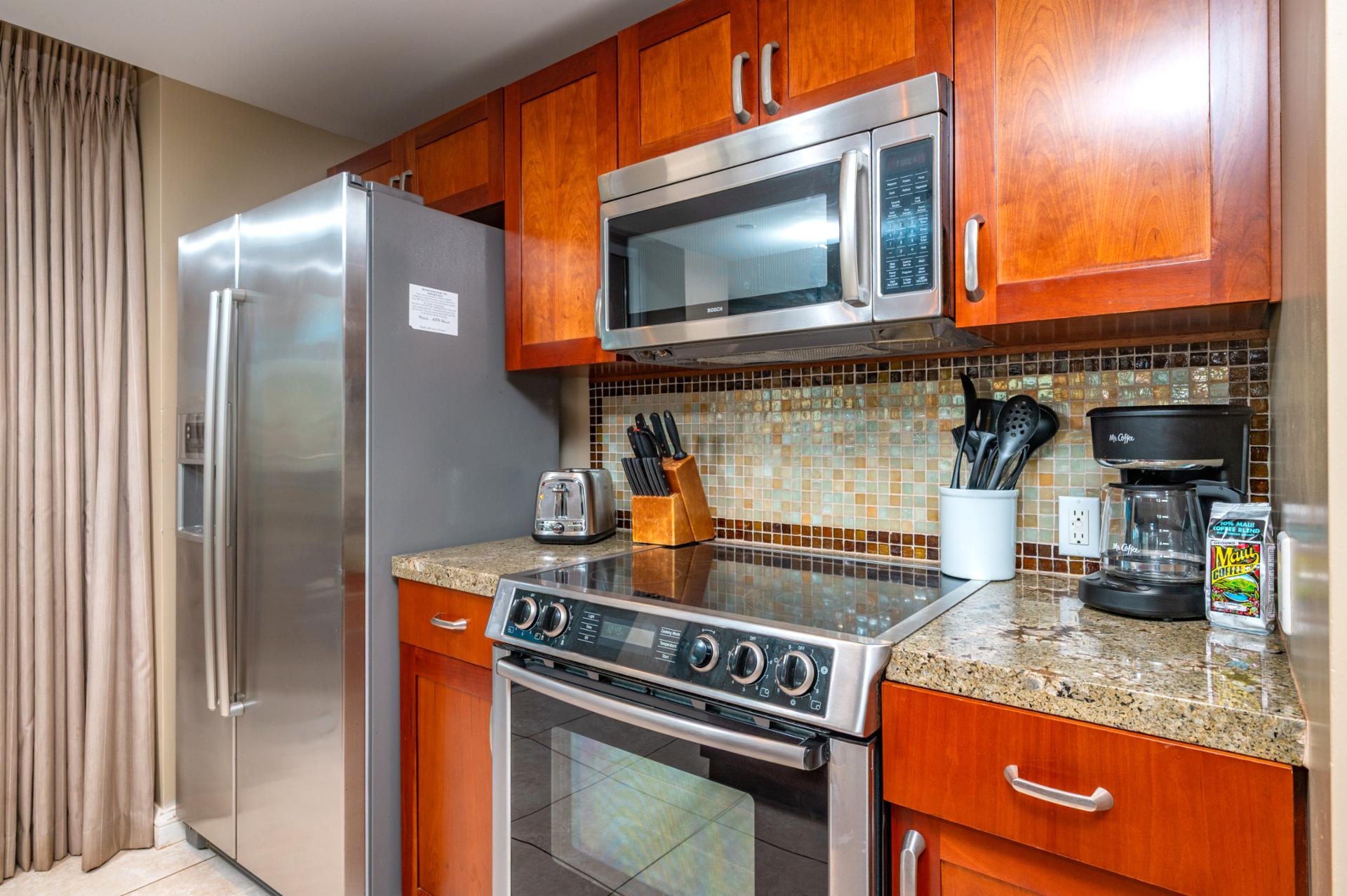 Everything you need is here, from the full-size fridge and glass cooktop to the coffee maker and toaster, for effortless meals and morning brews.