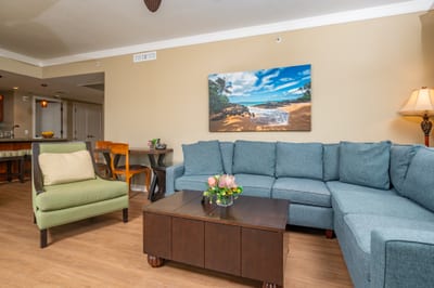 The living area offers plenty of seating for your group, with a large sectional, accent chair, and convenient desk for work or planning island adventures. HKH-520