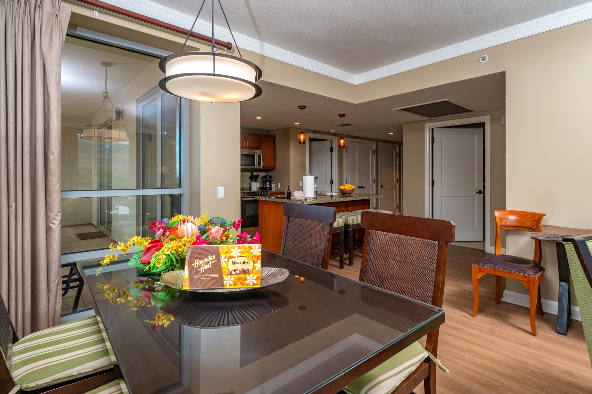 The open dining area connects seamlessly to your fully equipped kitchen, perfect for home-cooked meals or island takeout enjoyed with family.