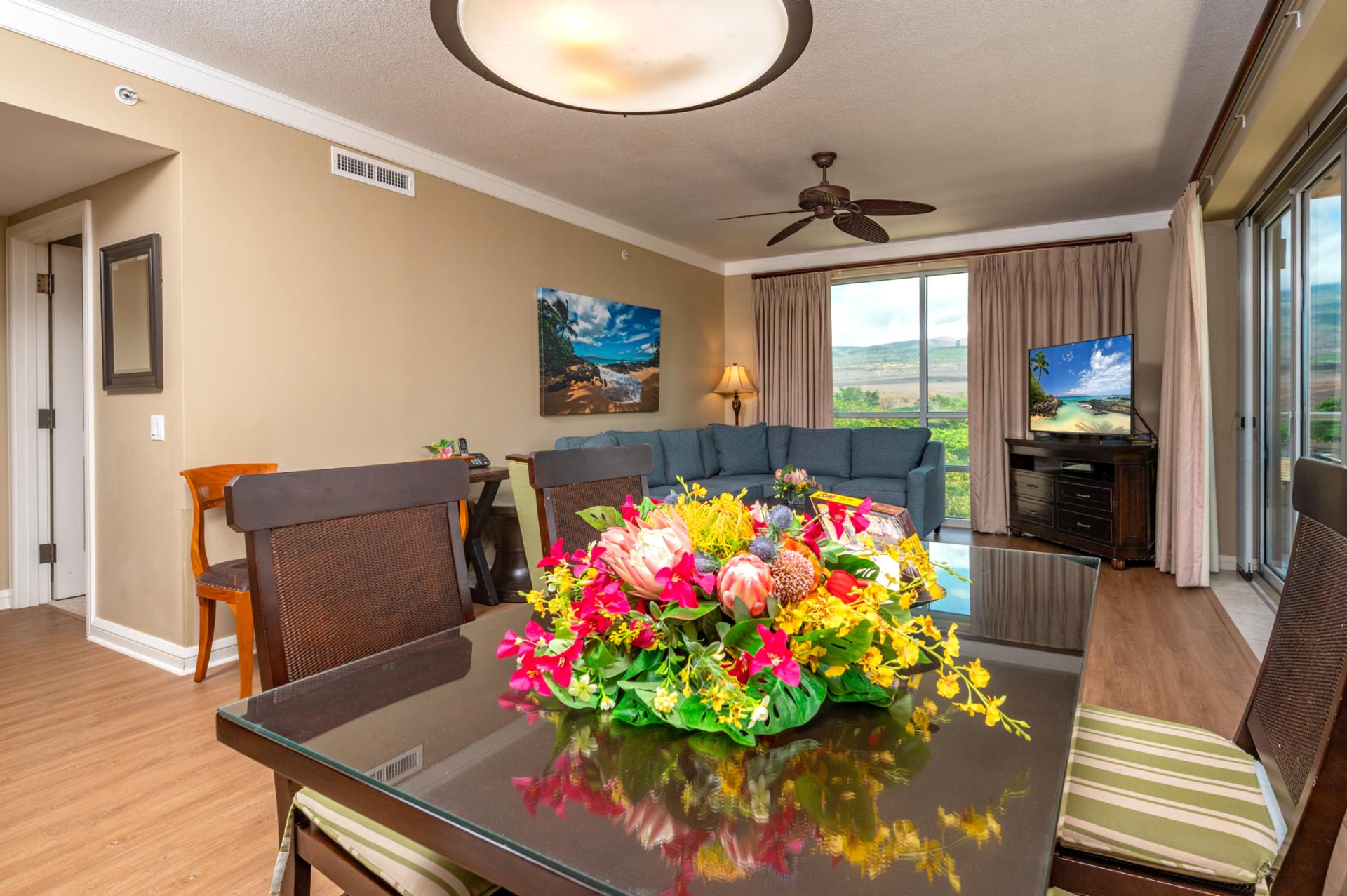 Enjoy meals and conversation in the open-concept dining and living area, with plenty of natural light and views of the West Maui Mountains.