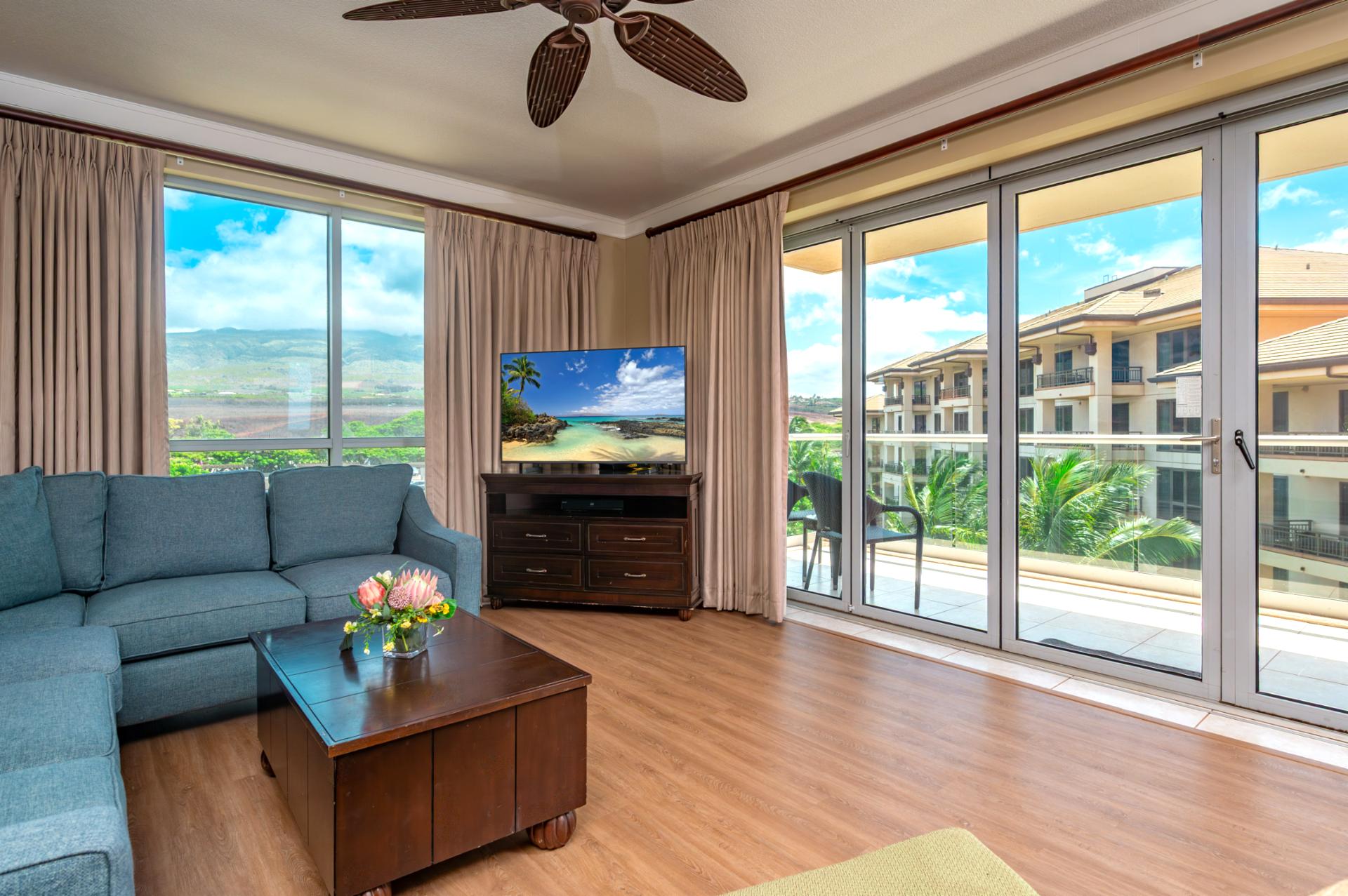 Floor-to-ceiling glass doors open to your wraparound lanai, blending indoor comfort with views of the West Maui Mountains and resort gardens.