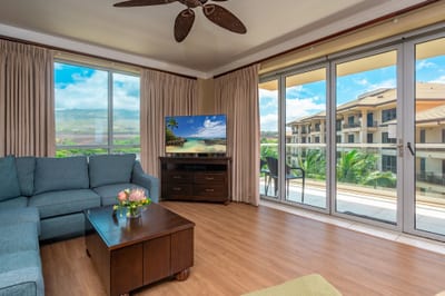 Floor-to-ceiling glass doors open to your wraparound lanai, blending indoor comfort with views of the West Maui Mountains and resort gardens. HKH-520