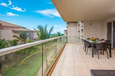 Dine outdoors with peekaboo ocean views and the sound of swaying palms, all from the comfort of your spacious covered lanai. HKH-520