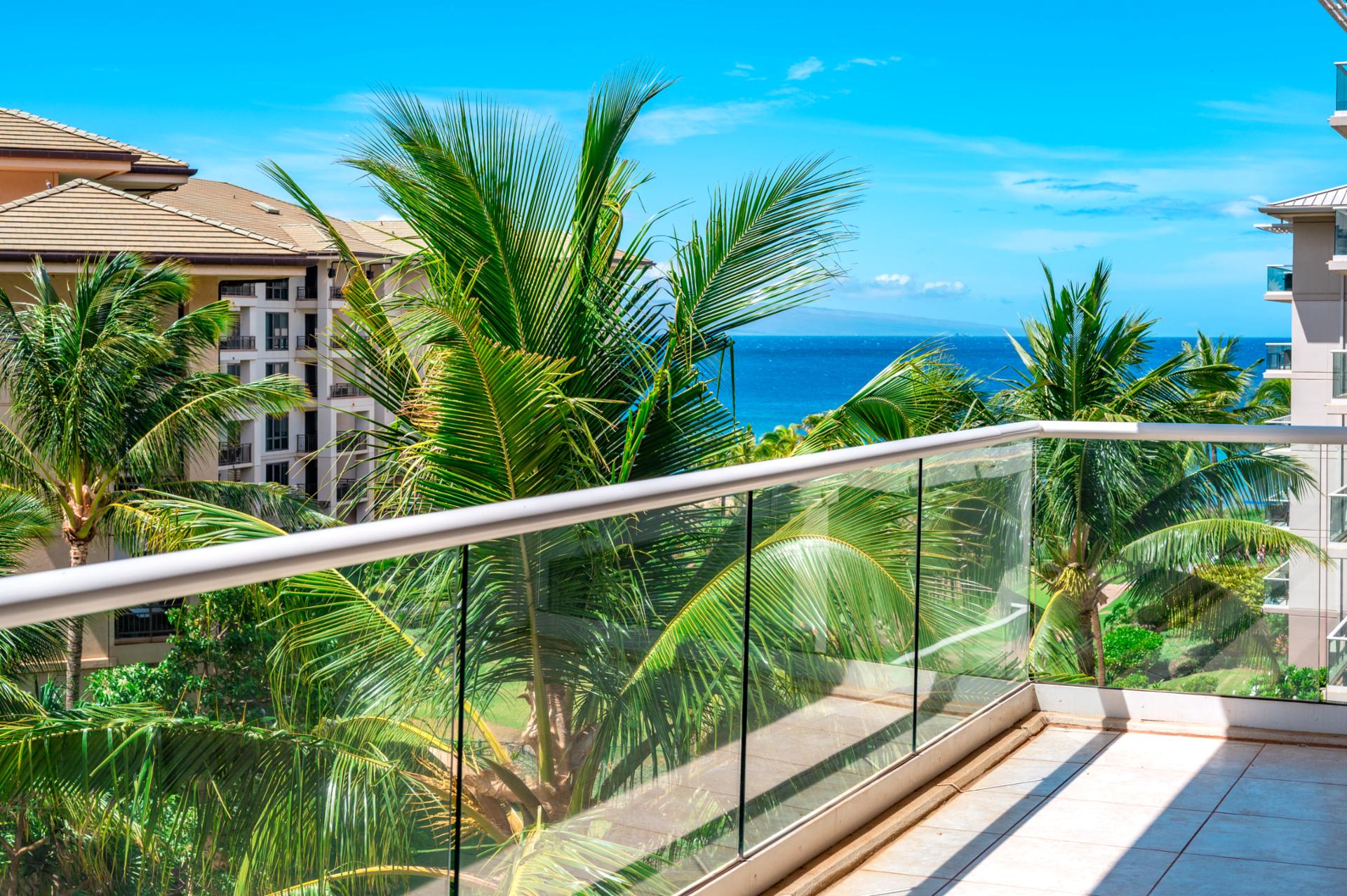Step onto your spacious lanai for sparkling ocean views framed by palms, perfect for morning coffee or evening breezes.