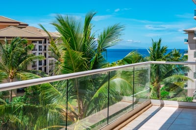 Step onto your spacious lanai for sparkling ocean views framed by palms, perfect for morning coffee or evening breezes. HKH-520