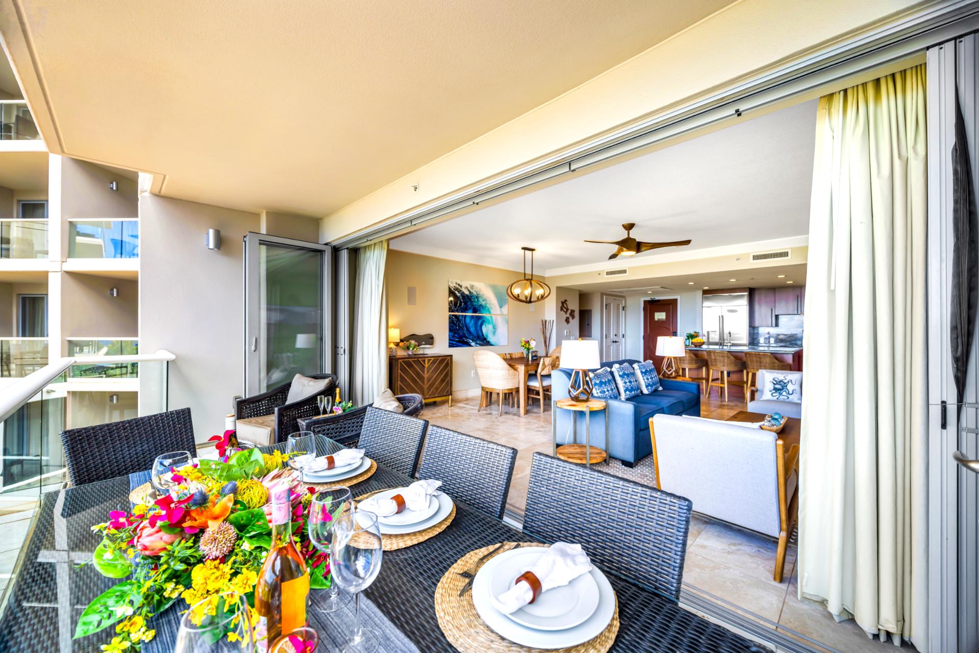 Spacious and shaded, this balcony offers a comfortable lounge area with views of the resort below.