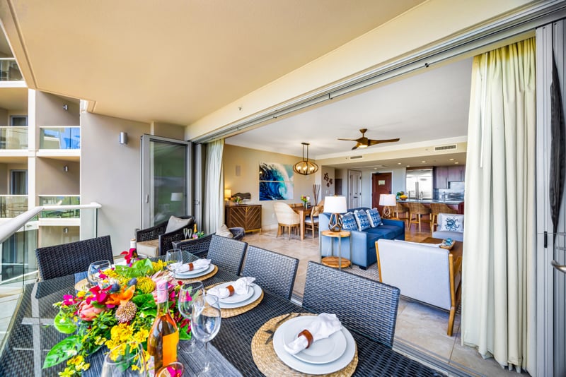 Spacious and shaded, this balcony offers a comfortable lounge area with views of the resort below. HKH-529