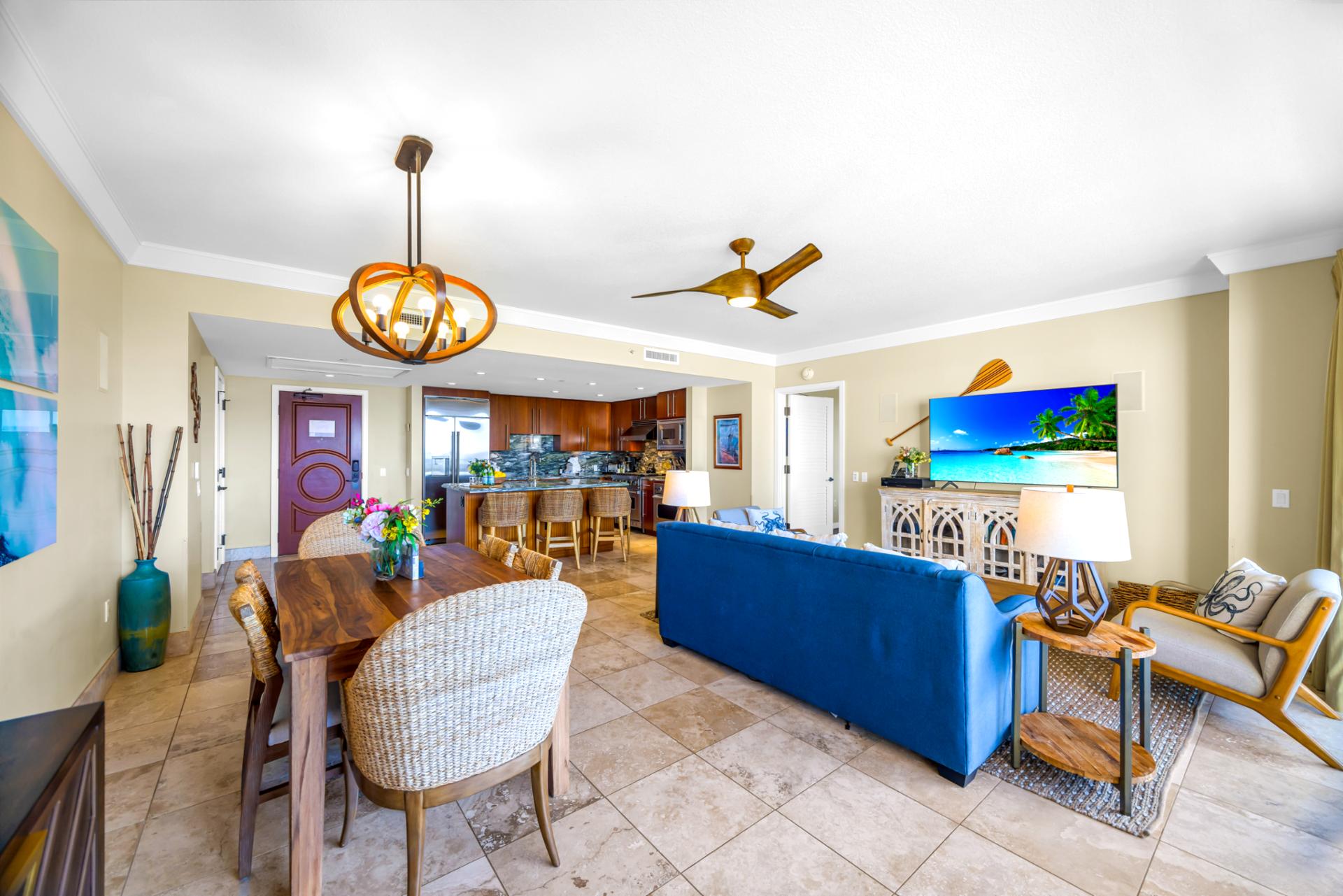 Spacious and open, this living area blends dining, lounging, and kitchen space with ease. Perfect for gathering after the beach.