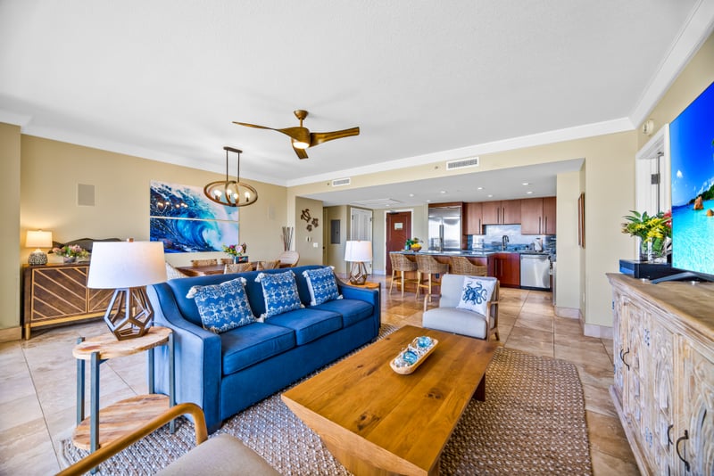 Your open-concept living room features ample seating and ocean glimpses, perfect for group hangouts or quiet evenings in. HKH-529