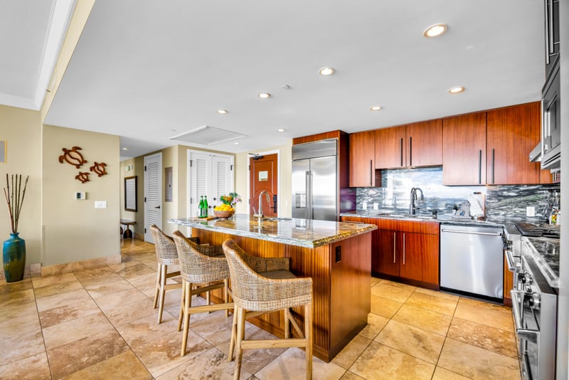 Island-inspired design meets function in this fully stocked kitchen with ample prep space and bar seating. HKH-529