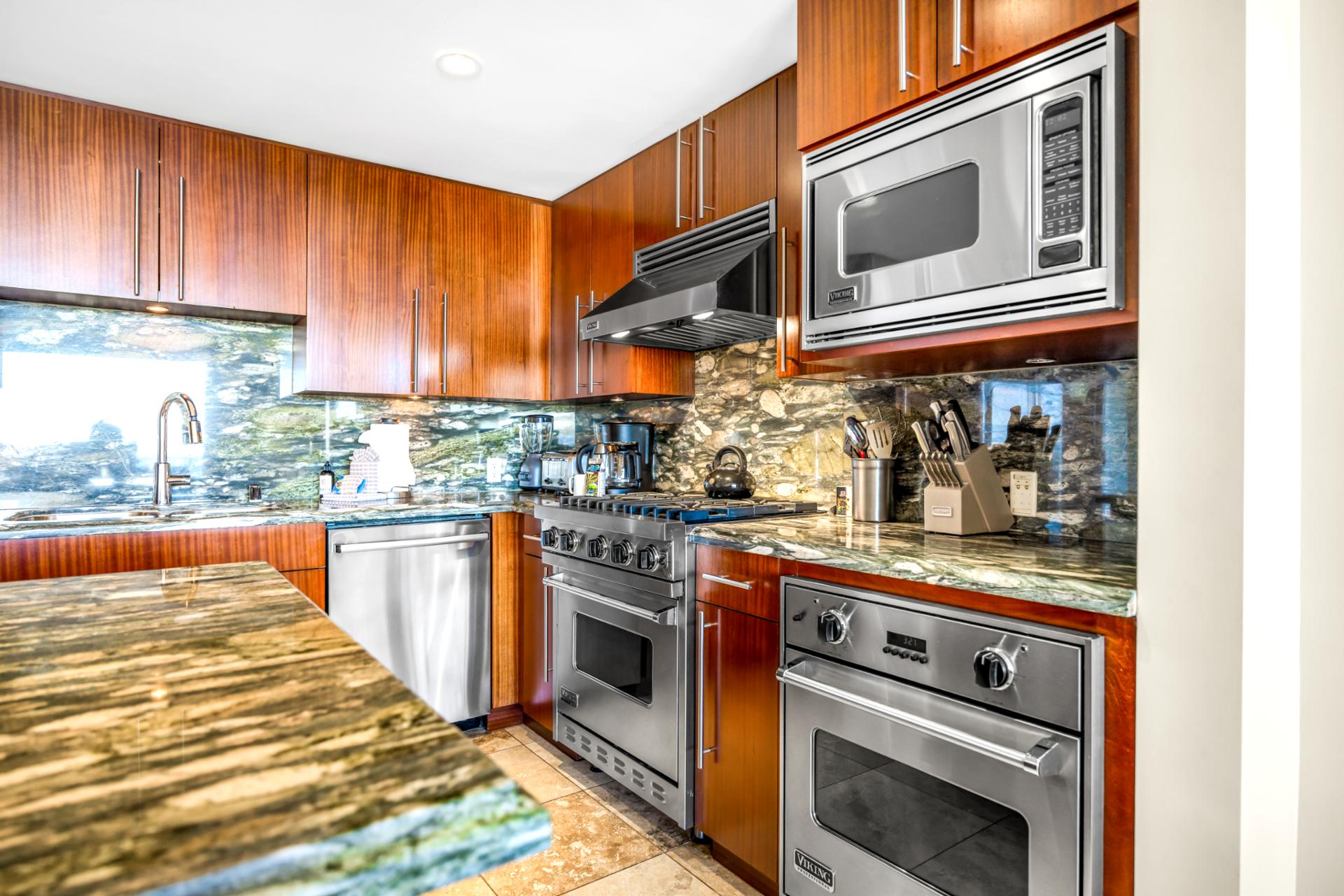 Granite counters and high-end stainless steel appliances give you everything you need to prep meals or beach snacks with ease.
