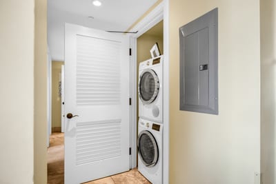 Enjoy the convenience of in-unit laundry with a full-size washer and dryer just off the hallway. HKH-529