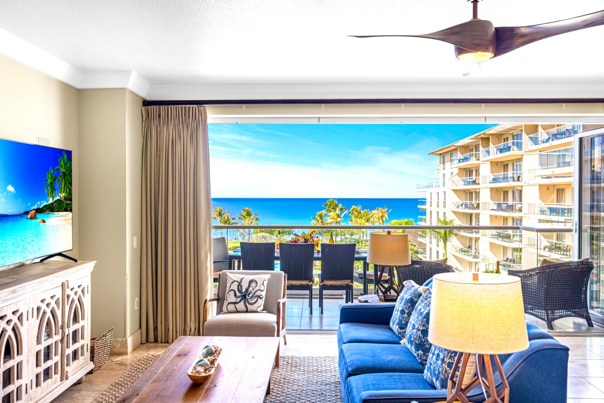 Bright and coastal, this living room invites conversation or a breezy retreat after sunset drinks on the balcony.