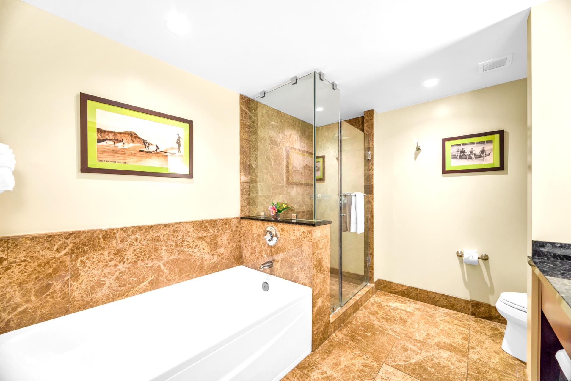 Guest Bath 1 offers a full layout with granite counters and a mix of tub and walk-in shower.