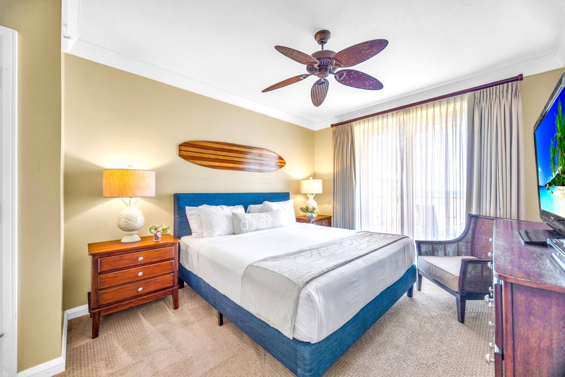 Your primary bedroom features a King bed, Smart TV, and blackout drapes for restful mornings after a late dinner on the balcony.