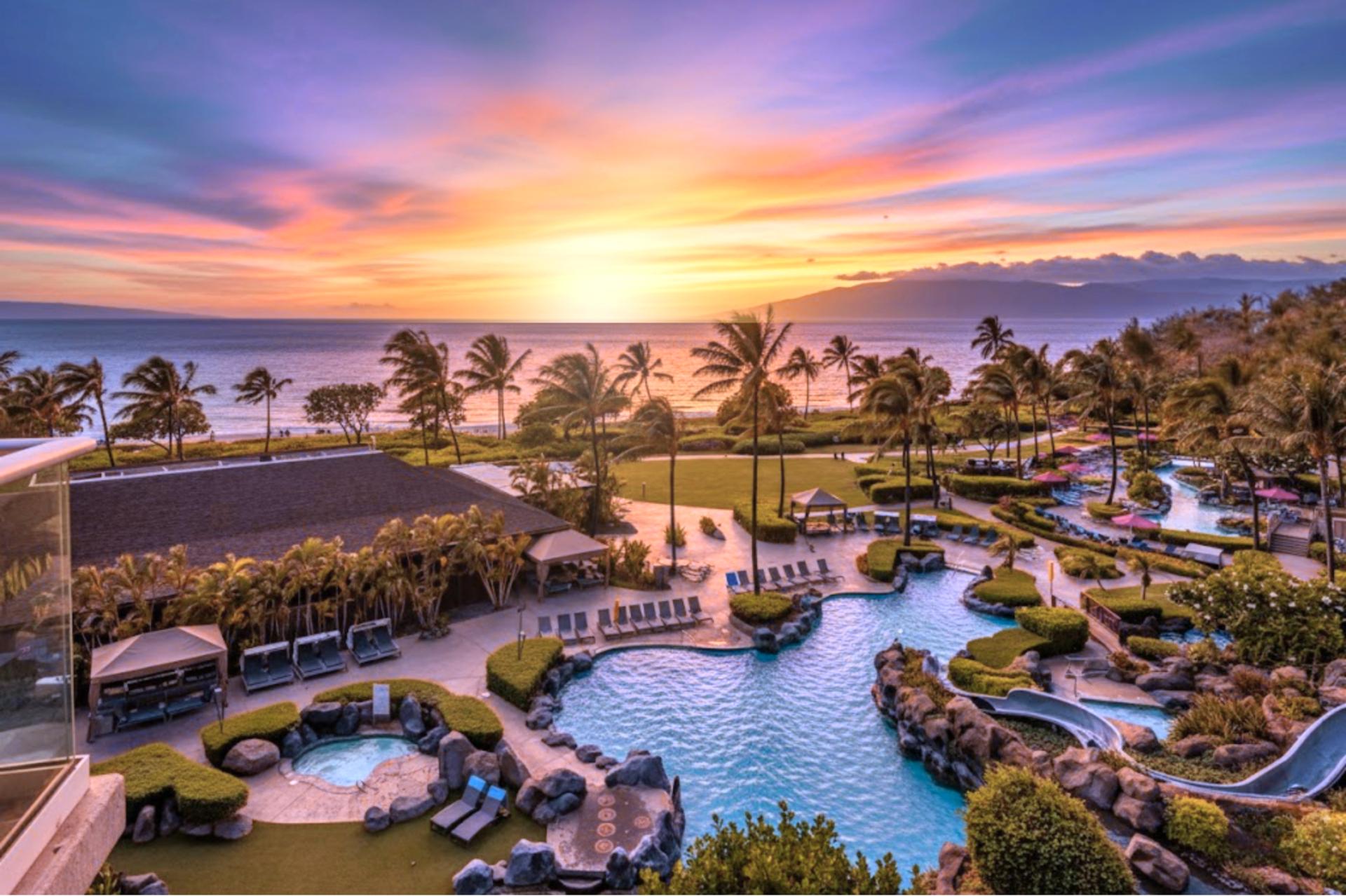 Sunrise paints the Maui sky over your Honua Kai oasis with shimmering pools and the Pacific beyond.
