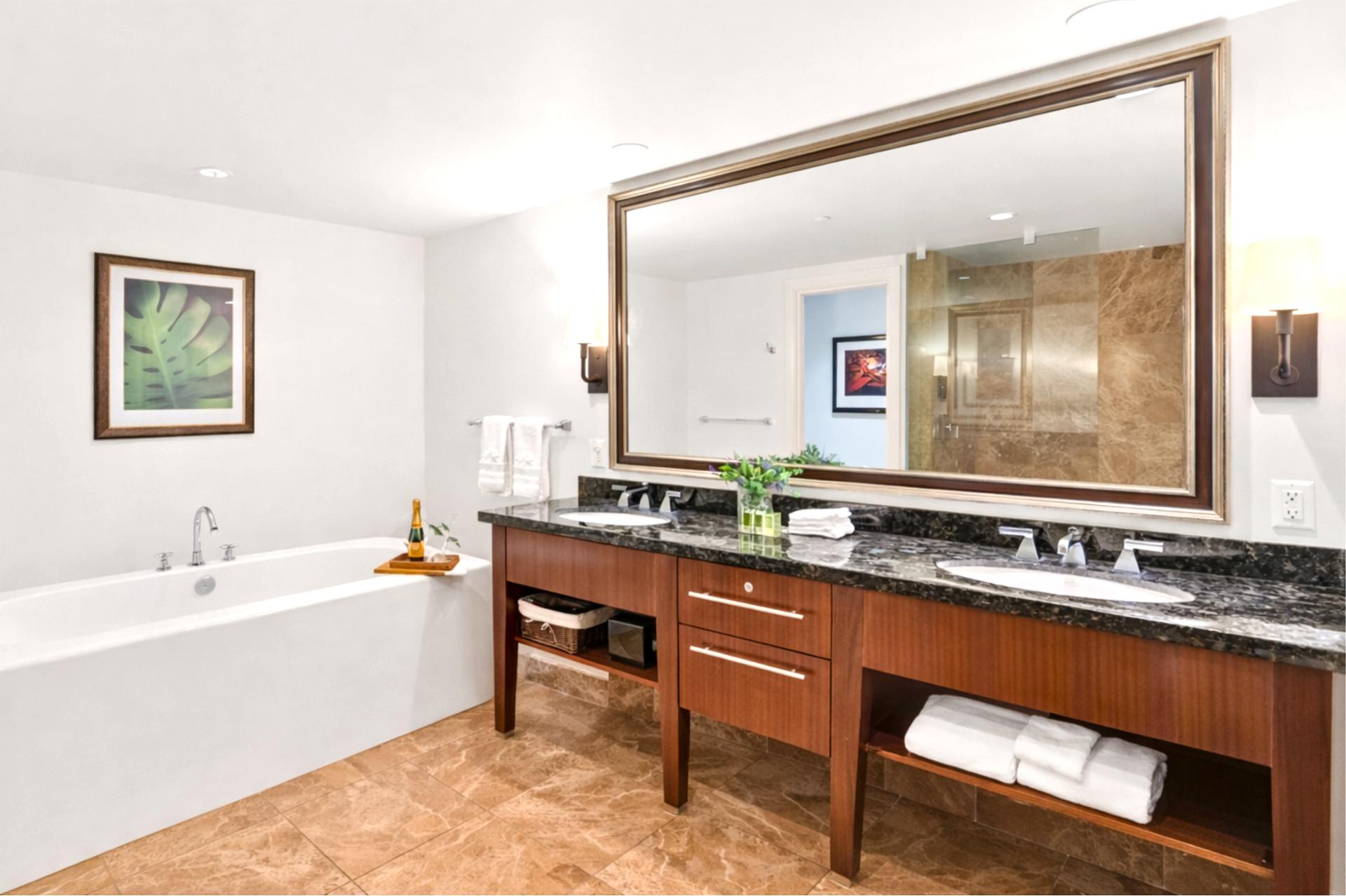 Dual vanity with granite counters and premium fixtures.