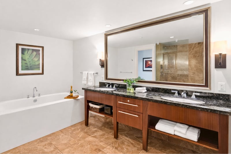 Dual vanity with granite counters and premium fixtures.