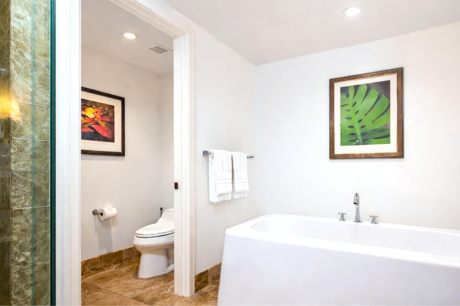 Separate water closet, tucked away for privacy. 