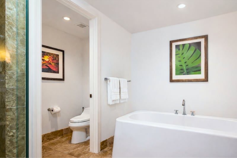 Separate water closet, tucked away for privacy.