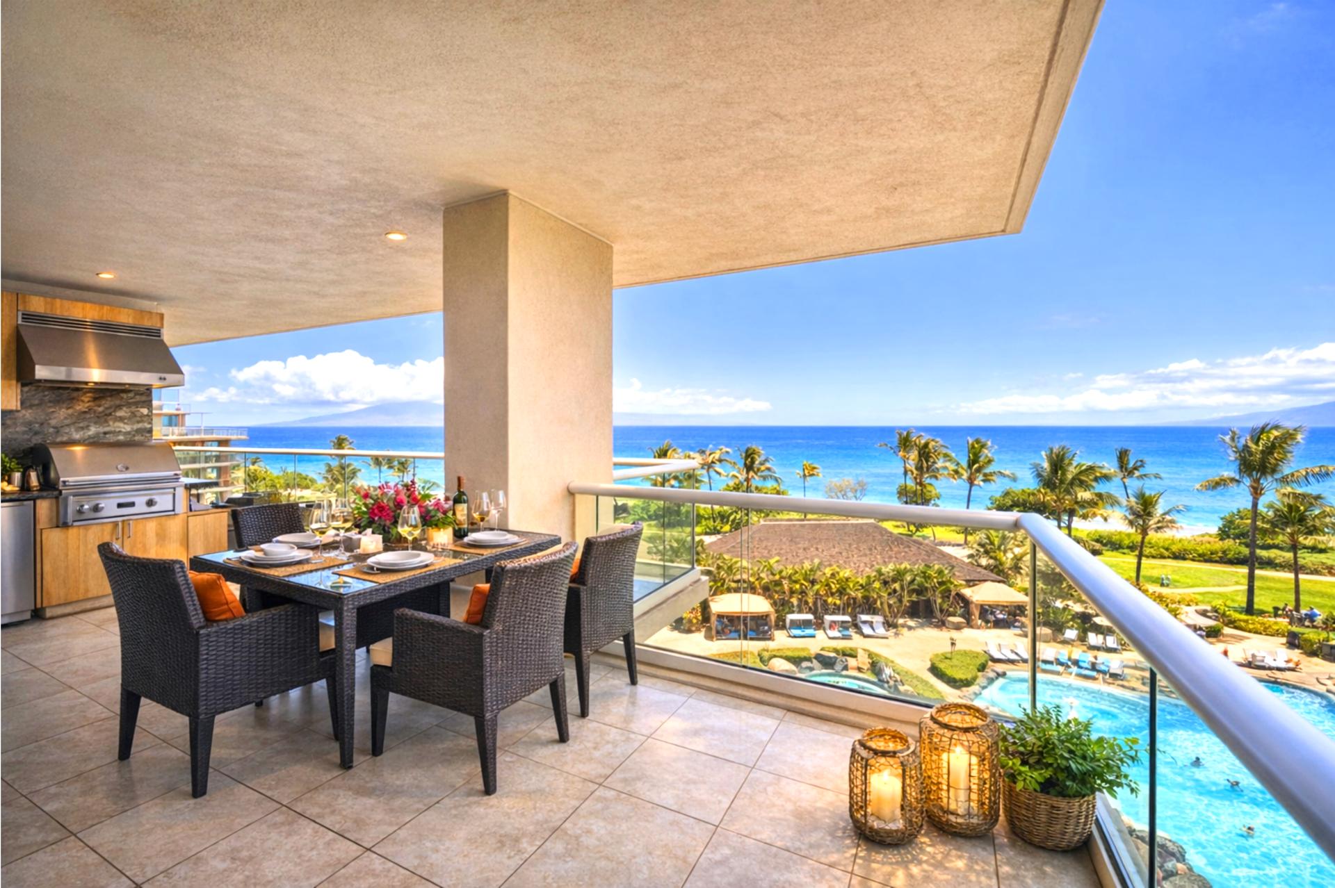 Expansive lanai with comfortable lounge seating and unforgettable sunset views.