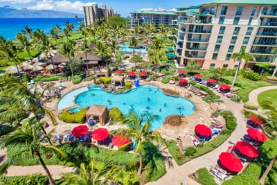 Look out over lagoon pools, palms, and the ocean, your daily playground in the heart of Maui HKH-603
