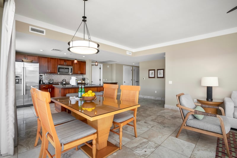 Open-concept luxury suite with gourmet kitchen, elegant dining, island living. HKH-609